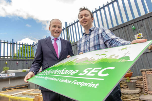 Repro Free
Provision 150422
Taoiseach Micheal Martin and Jake Mc Auliffe, Chairperson Ballyphehane SEC at the announcement of an Energy Master Plan for the Ballyphehane Community.
Ballyphehane Sustainable Energy Community (SEC), in partnership with Ballyphehane Community Association, announced today the launch of its Energy Master Plan (EMP) which was commissioned to accelerate the transition to a more sustainable future for Ballyphehane and its population. The Energy Master Plan presents an overall vision and direction for the local area with the aim to reduce energy demand, power the community with renewable sources of energy, and stimulate domestic retrofitting. The Ballyphehane Community SEC is hosting an information evening on 31st May 2022 at 7.30pm in the Ballyphehane Community Centre and would encourage all local residents and businesses to attend to learn more about opportunities and benefits of retrofits for private households. For more information visit www.ballyphehanecc.com/sec.
Pic Michael Mac Sweeney/Provision